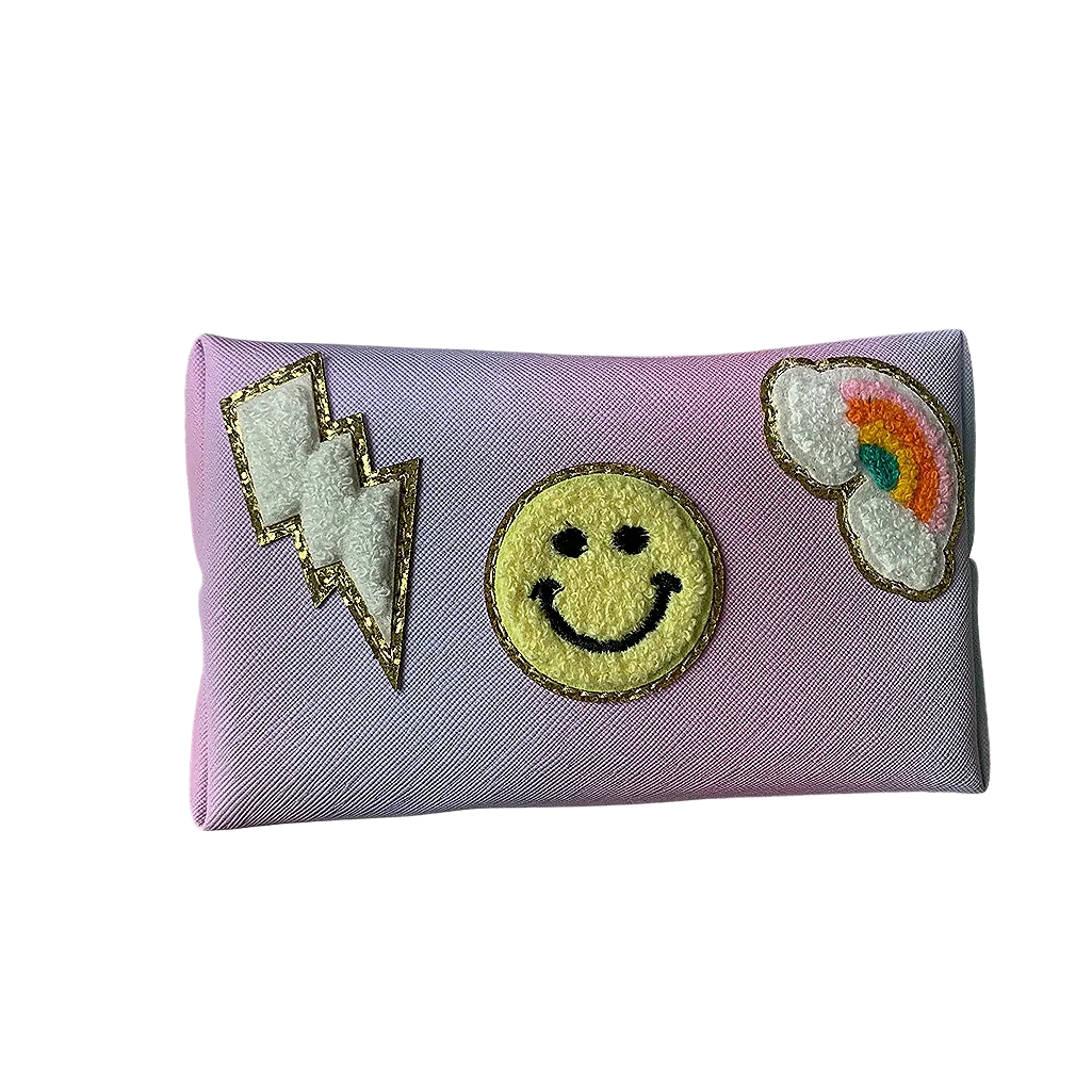 Washing bag designing with a smiley face, rainbow, and lightning bolt